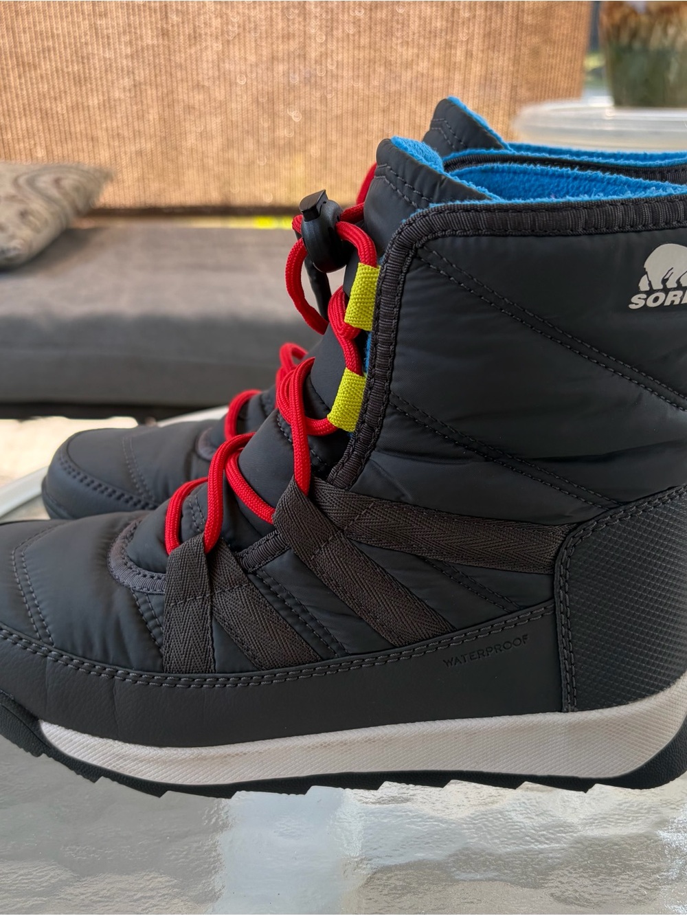 Sorel Kids Black Winter Boots with Red Laces and Blue Lining